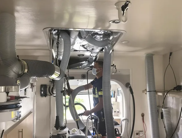 Holliston Air Duct Cleaning specialist performing precise mobile home duct cleaning in Holliston