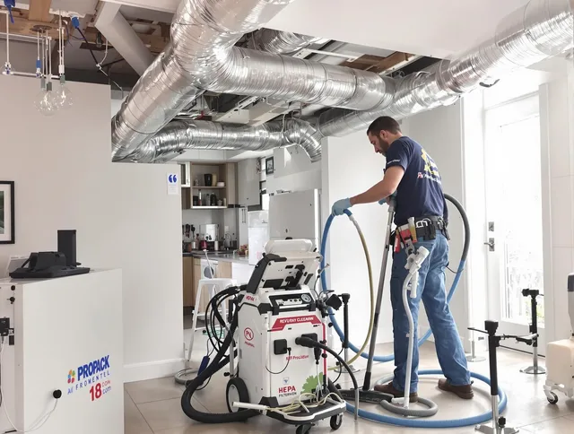 Holliston Air Duct Cleaning technician performing advanced pure duct cleaning with specialized equipment in Holliston